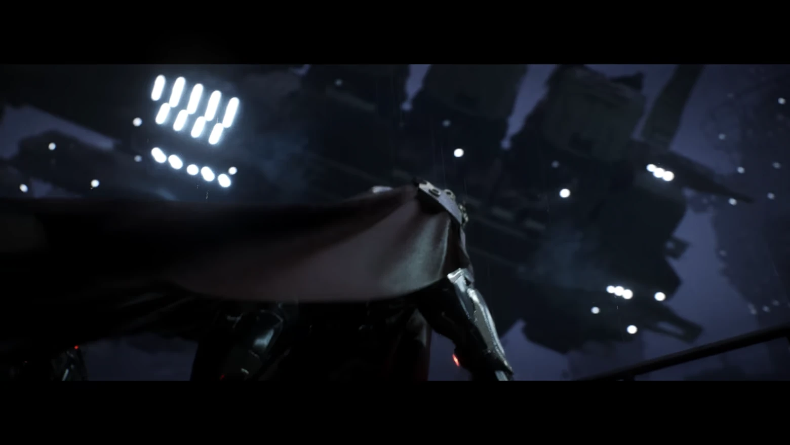 Towering Mech Silhouette – AINUR AINUR: Cloaked armored figure seen from behind under bright lights in dark rain.
