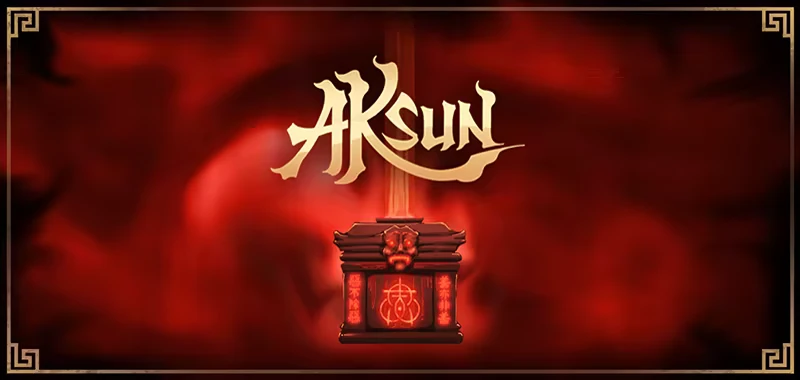 Aksun: Stylized title text above a glowing red artifact with intricate symbols and a face motif.