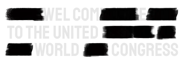 Democracy Manifest: White stencil text “WELCOME TO THE UNITED WORLD CONGRESS” on black strips.
