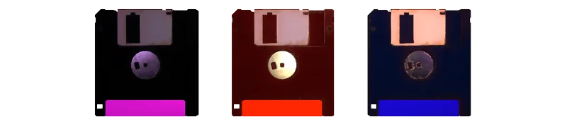 Die to Play: Three floppy disk icons with purple, red, and blue label bars on black.