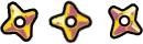 DOPAMINER: Three yellow-and-pink four-pointed stars with black centers on black background.
