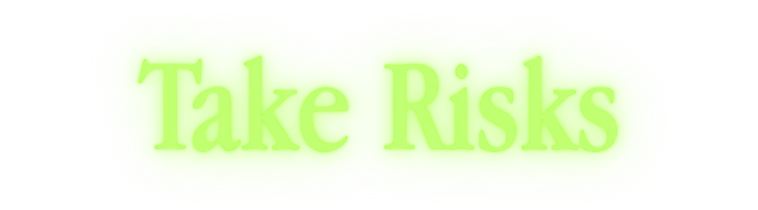 Take Risks Sign – FINITE JEST FINITE JEST: Neon green button with glowing border and faint serif text “Take Risks”.