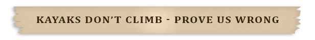 Kayaks Don't Climb: Beige wooden sign with bold text, "KAYAKS DON'T CLIMB - PROVE US WRONG".