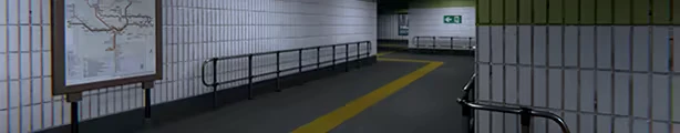 Metrophobia: Empty tiled metro corridor with yellow path line and green exit sign.