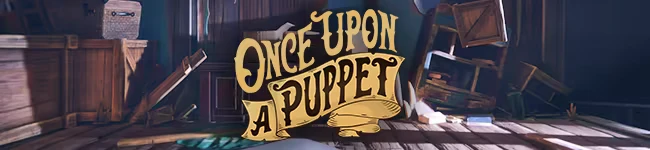 Once Upon A Puppet: Wooden crates and a suitcase on a dimly lit stage with stylized title text.