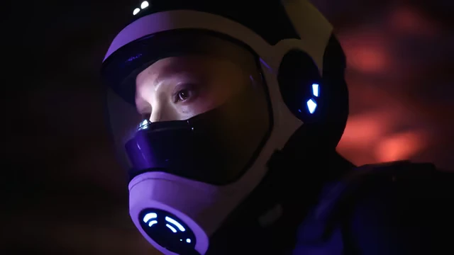 Project Vesperi: A person in a futuristic helmet with glowing blue lights against a dark background.
