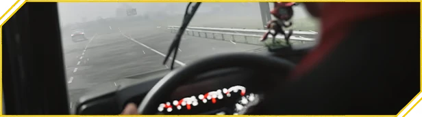 Road Kings: Truck cab view in foggy rain, wipers on, highway lanes and guardrail ahead.