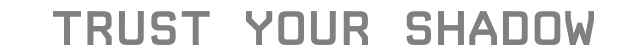 Trust Your Shadow – Sea of Tranquility Sea of Tranquility: Gray text reads "TRUST YOUR SHADOW" on a black background.