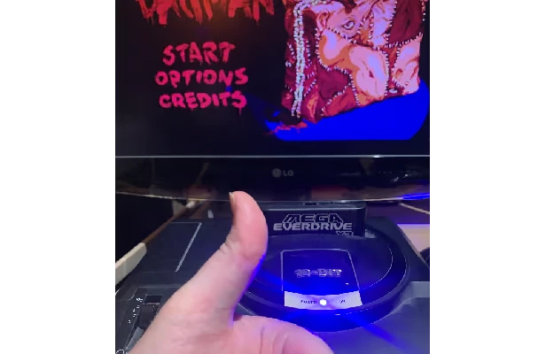 The Bagman: Title screen with red START, OPTIONS, CREDITS text on a TV above console.