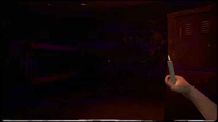 TROX-THE REVERSAL: A hand holds a lit candle in a dark room with lockers and faint red lighting.