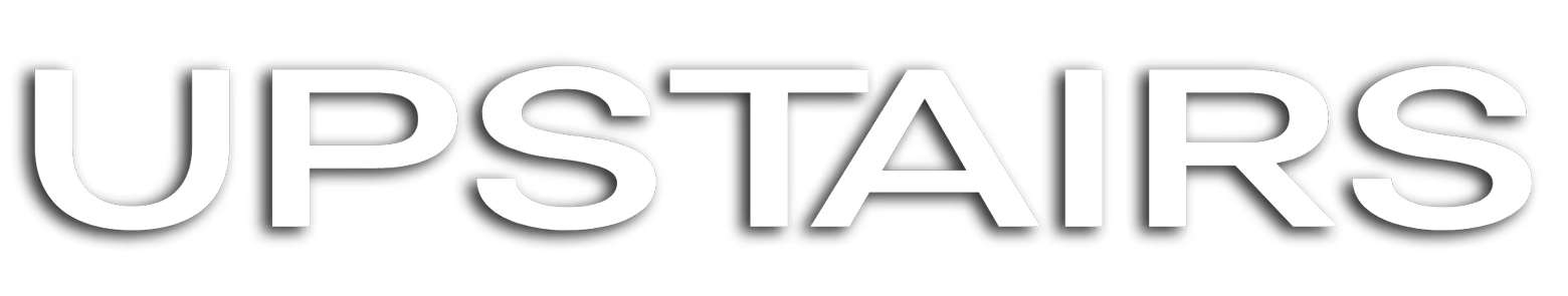 Upstairs: Bold white text "UPSTAIRS" on a black background.
