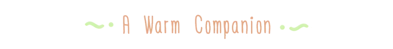 Warm Companion Text – Woodo Woodo: Title text “A Warm Companion” in tan serif letters with green flourishes.